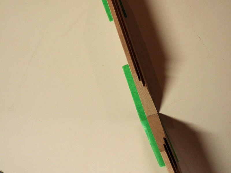 tape lines up joints on picture frame